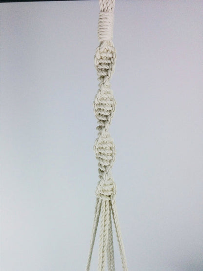 Macramé hanging planter with copper