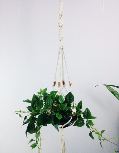 Macramé hanging planter with copper